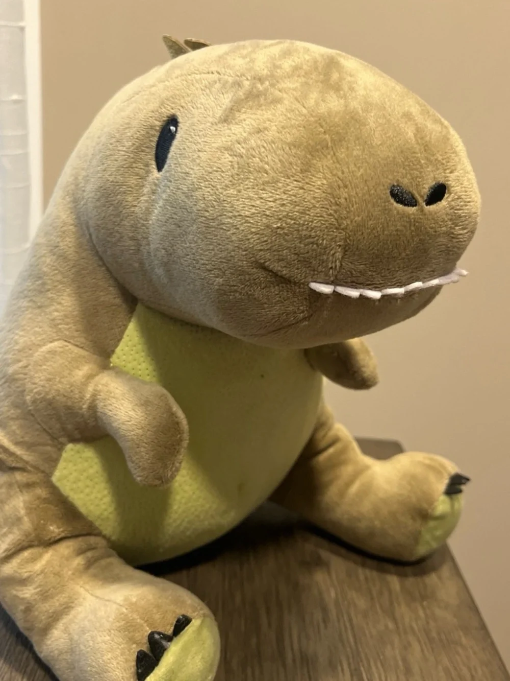 Dinosaur plush with pocket for storing treasures
